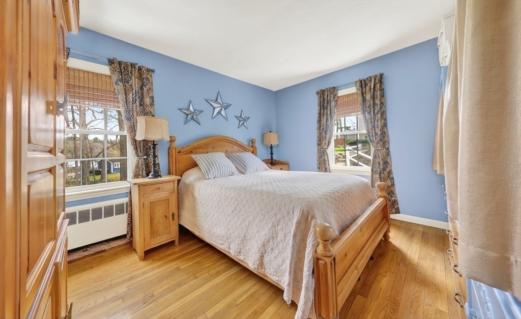 15 Leigh Road Norwell, MA 02061 - Photo 16 of 34 a bedroom with a bed and a large window