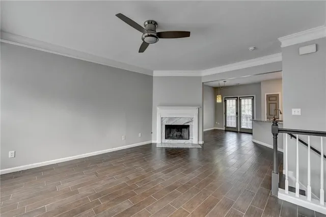 wooden floor in an empty room with a fireplace