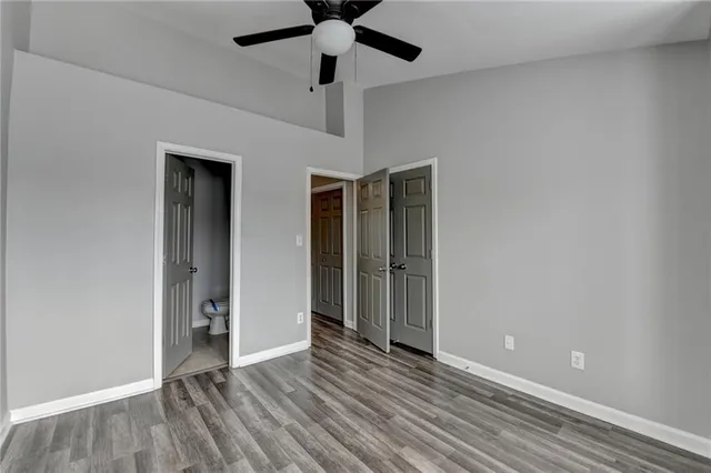 a bathroom with a sink mirror and toilet