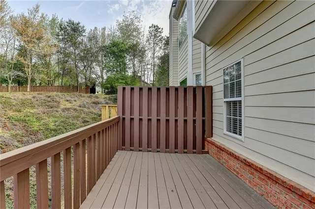 a view of wooden deck and trees