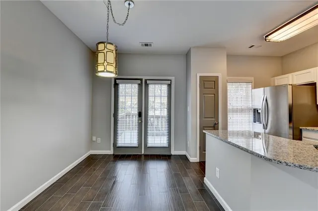 a view of a bathroom with dual sinks