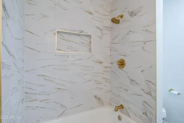 a bathroom with a sink and a large mirror