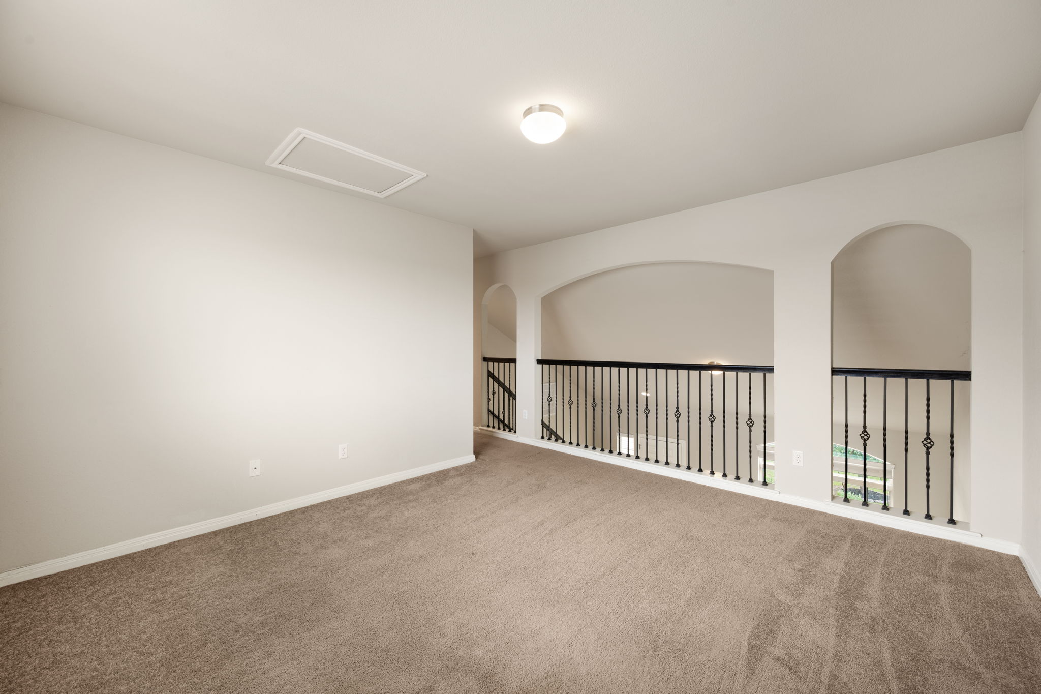 12701 Carillon Way Manor, TX 78653 - Photo 14 of 20 Versatile loft space featuring neutral carpeting and light-toned walls