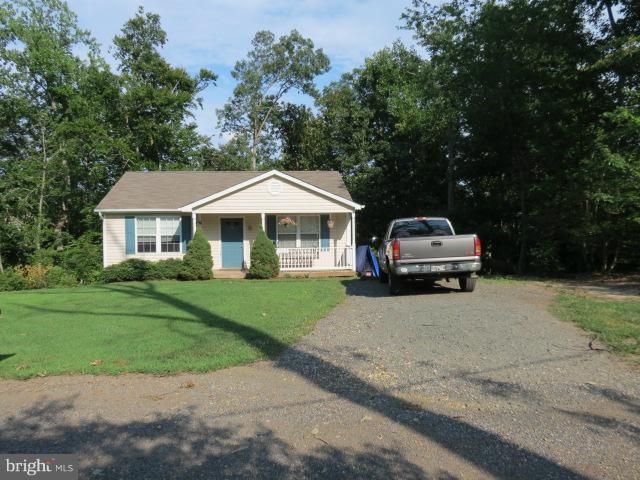 12622 Hilltop Road Lusby, MD 20657 - Photo 3 of 23 a car parked in front of a house