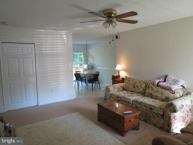 12622 Hilltop Road Lusby, MD 20657 - Photo 4 of 23 a living room with furniture and a chandelier