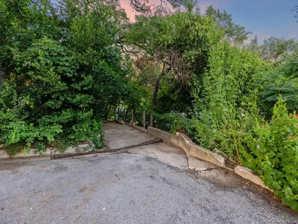 a view of a street with a trees