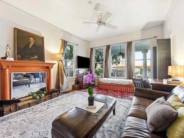 a living room with furniture and a flat screen tv