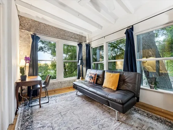 a living room with furniture and a large window