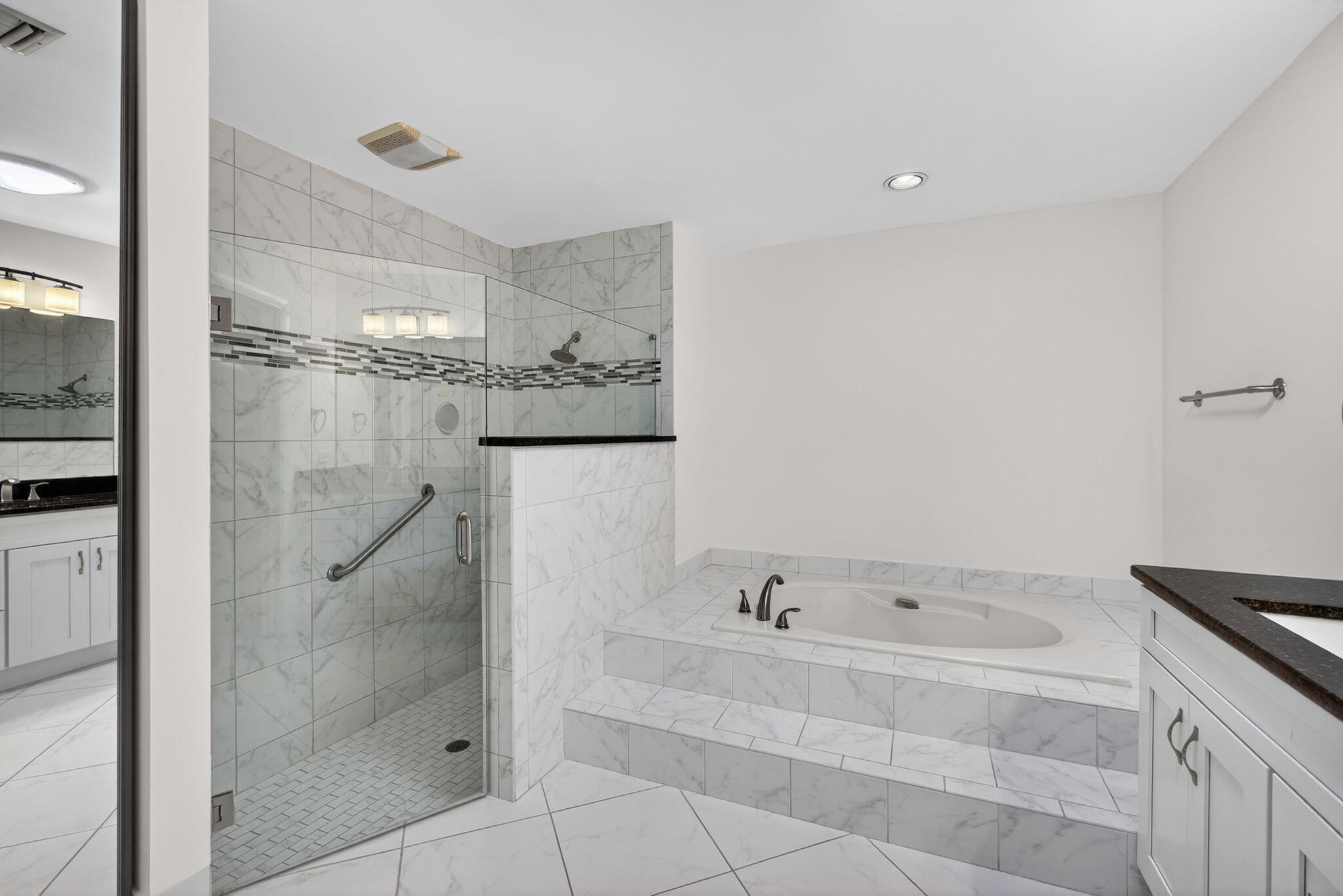 141 Cape Pointe Circle Jupiter, FL 33477 - Photo 15 of 31 a bathroom with a bathtub and shower