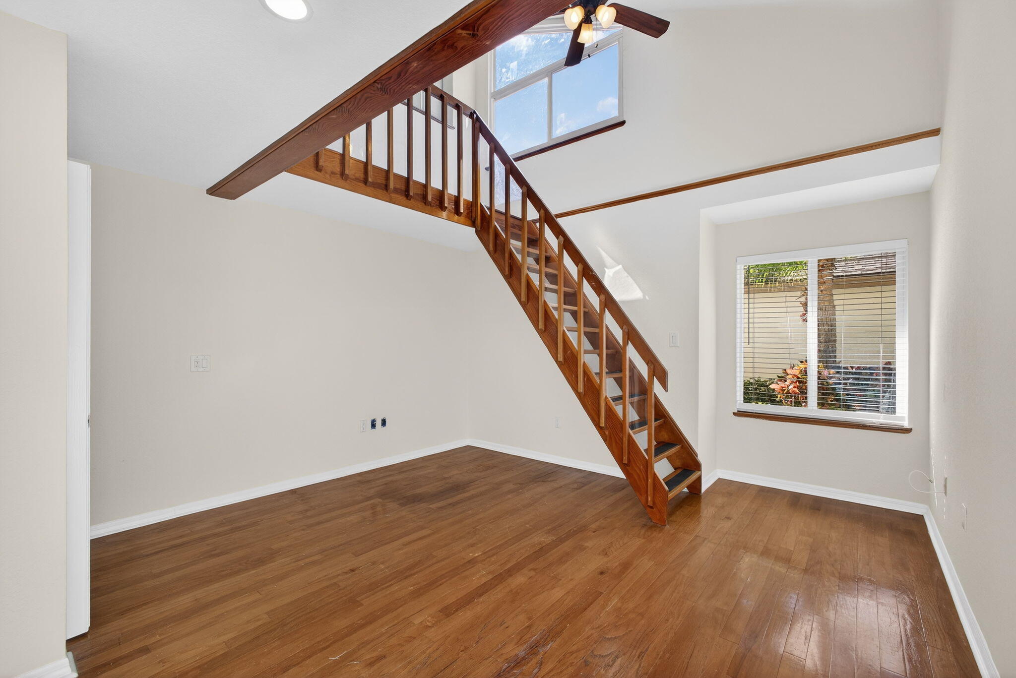 141 Cape Pointe Circle Jupiter, FL 33477 - Photo 18 of 31 a view of an entryway with wooden floor and stairs