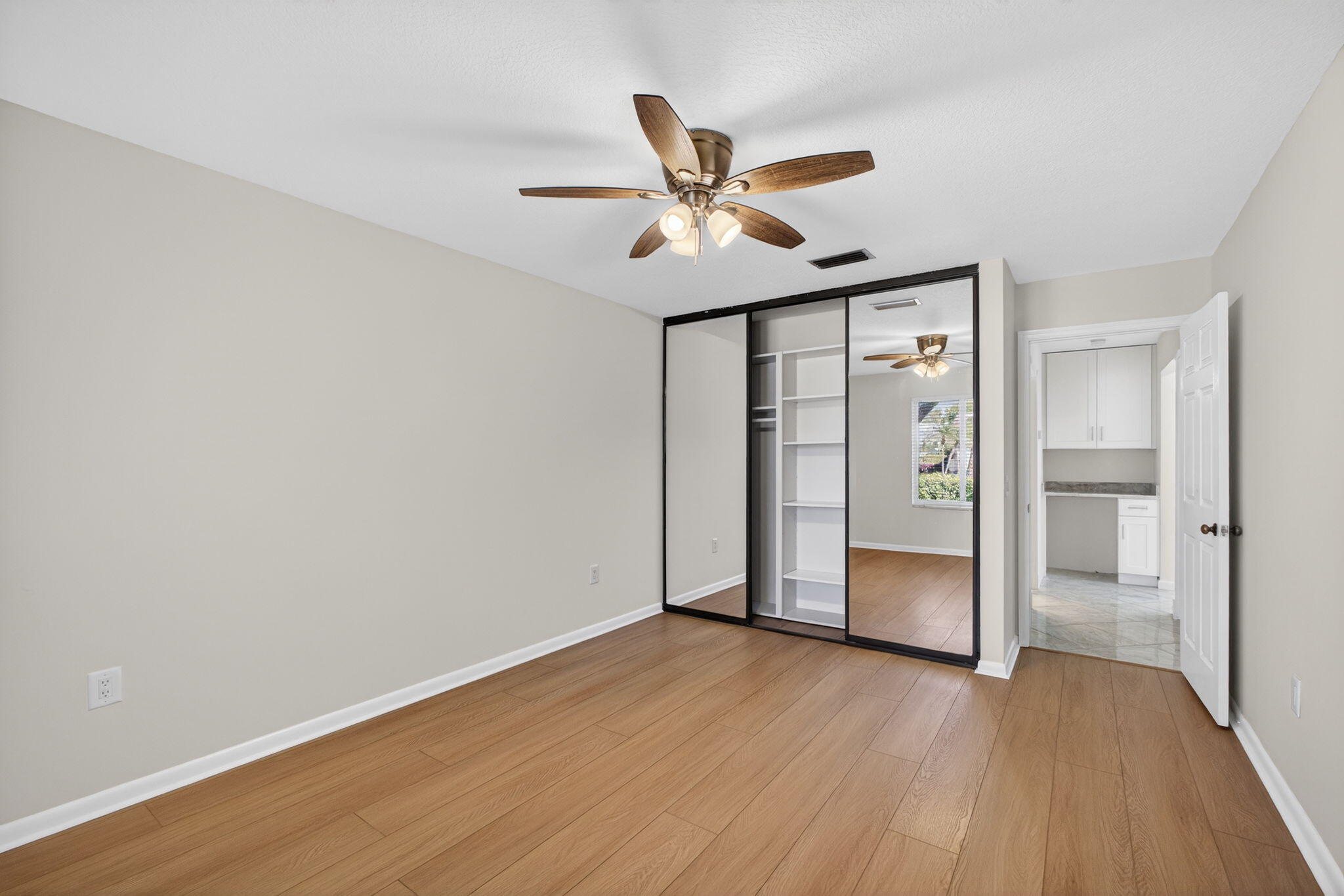 141 Cape Pointe Circle Jupiter, FL 33477 - Photo 25 of 31 a view of empty room with wooden floor