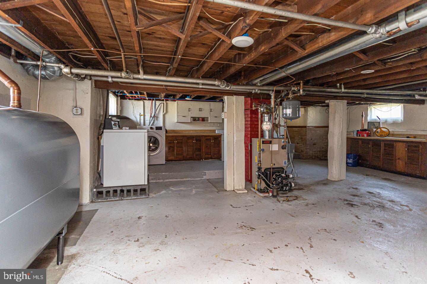 1525 Yardley Newtown Road Yardley, PA 19067 - Photo 13 of 15 a view of water heater room with refrigerator