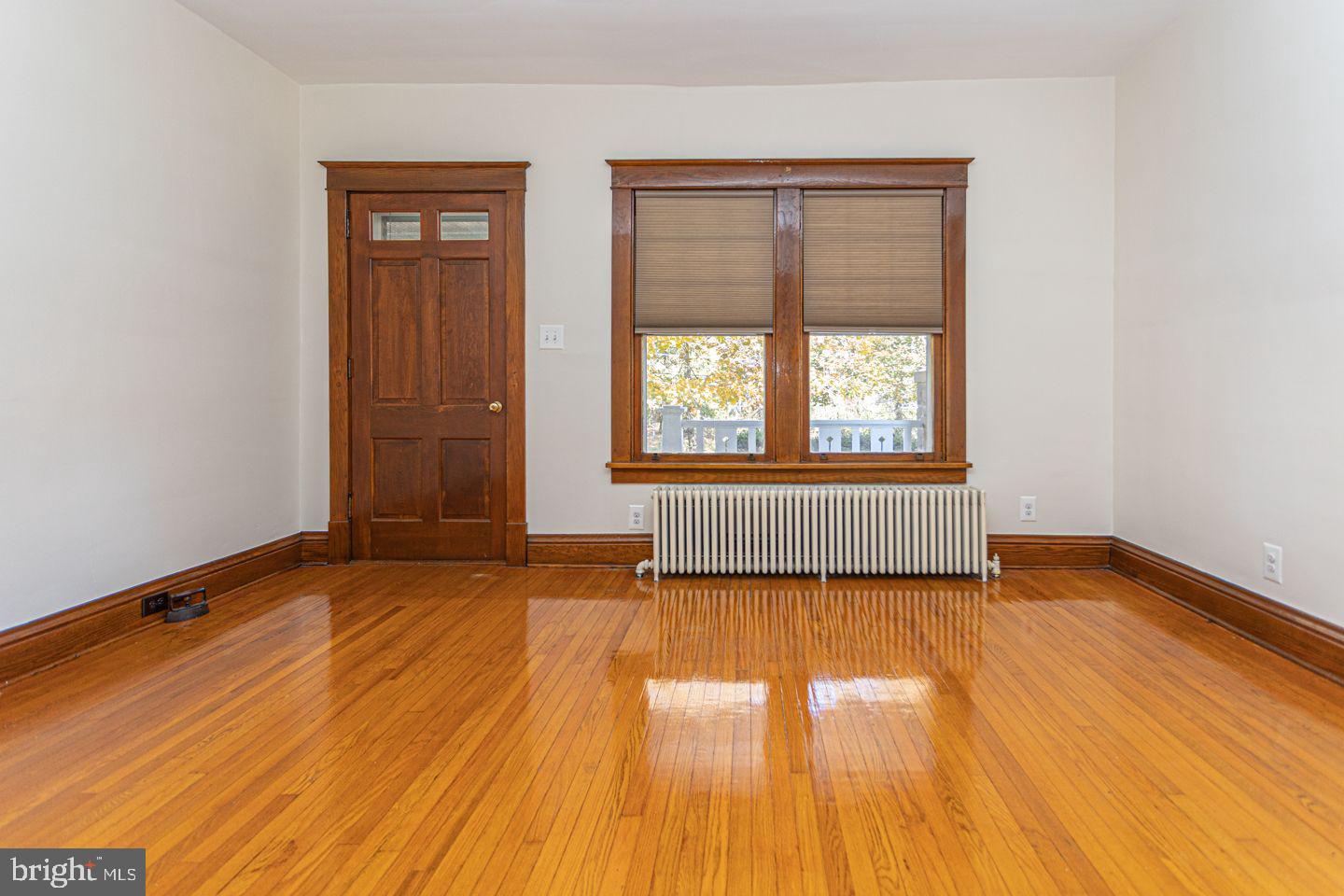 1525 Yardley Newtown Road Yardley, PA 19067 - Photo 3 of 15 an empty room with wooden floor and windows