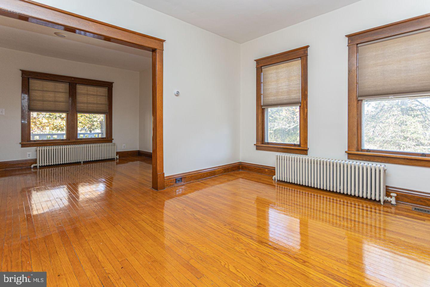 1525 Yardley Newtown Road Yardley, PA 19067 - Photo 4 of 15 a view of an empty room with glass door and wooden floor