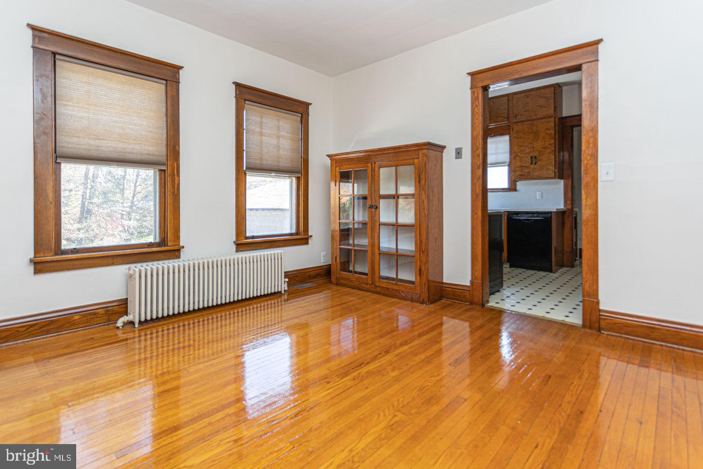 1525 Yardley Newtown Road Yardley, PA 19067 - Photo 5 of 15 an empty room with wooden floor and windows