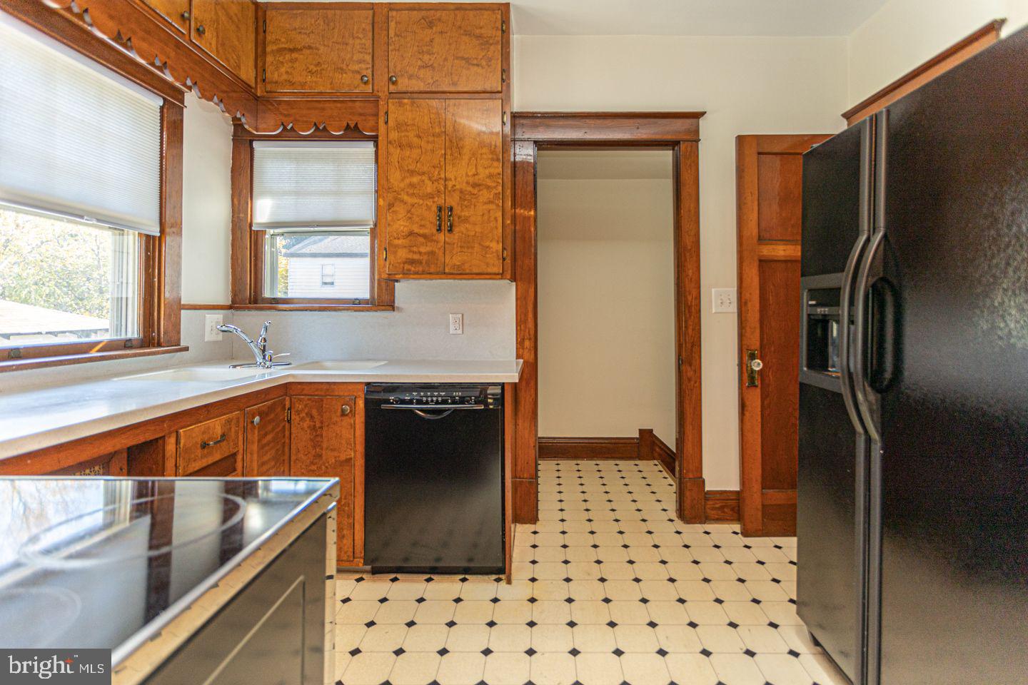 1525 Yardley Newtown Road Yardley, PA 19067 - Photo 6 of 15 a kitchen with granite countertop a refrigerator and a sink