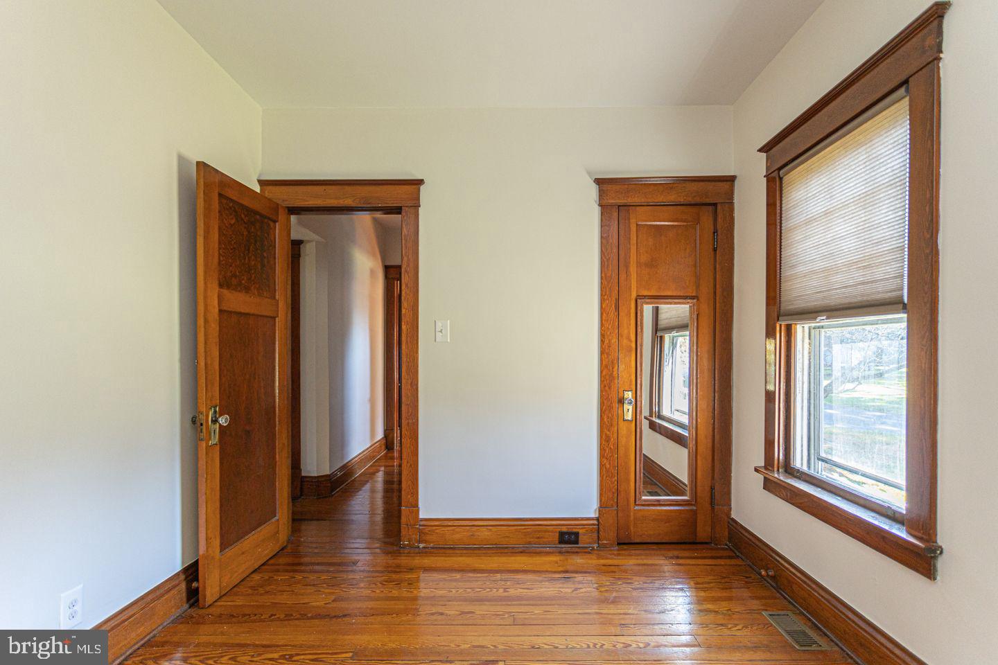 1525 Yardley Newtown Road Yardley, PA 19067 - Photo 8 of 15 an empty room with wooden floor and windows