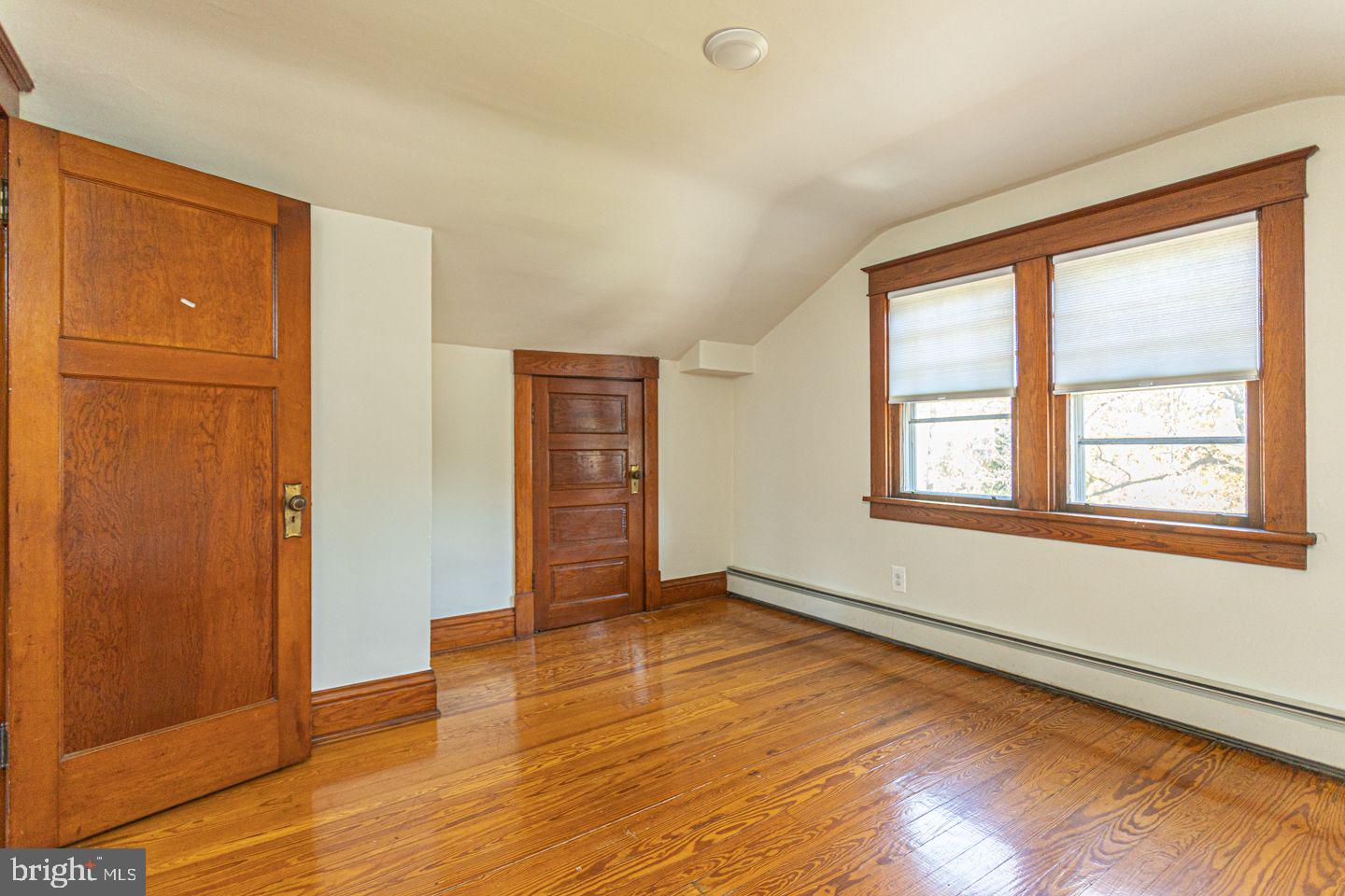 1525 Yardley Newtown Road Yardley, PA 19067 - Photo 10 of 15 an empty room with wooden floor and windows