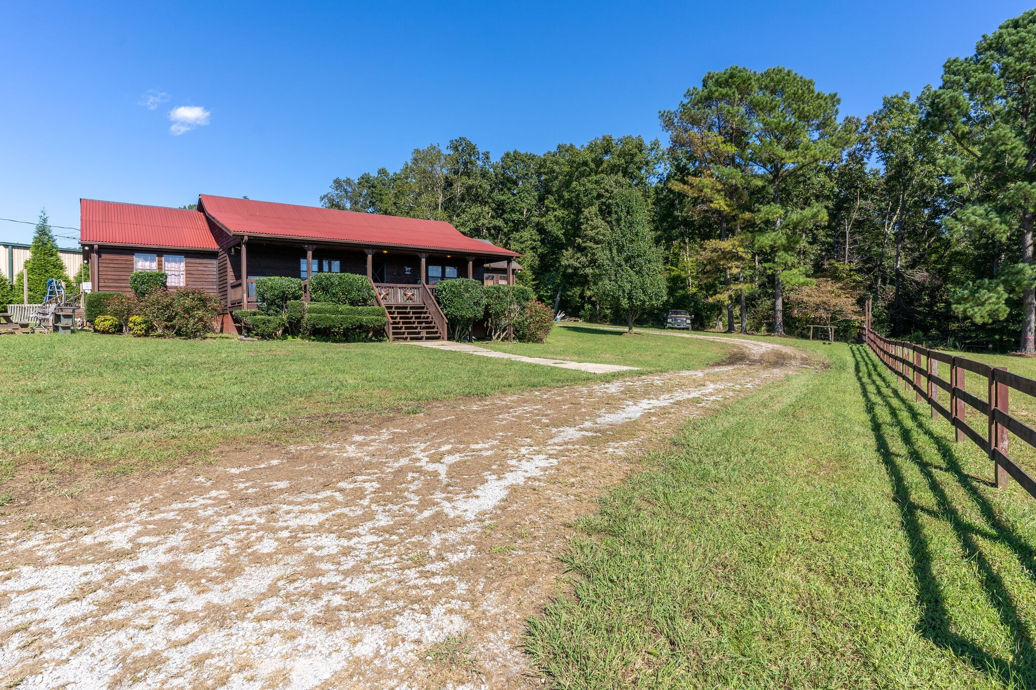 580 Eno Road Dickson, TN 37055 - Photo 2 of 48 a view of a house with a yard and sitting area