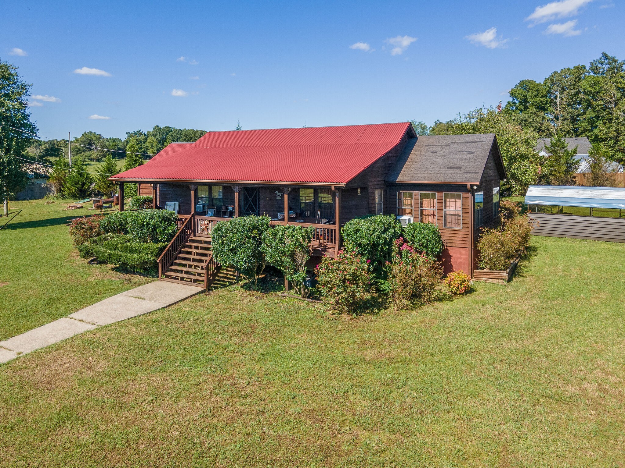 580 Eno Road Dickson, TN 37055 - Photo 43 of 48 a view of a house with a yard porch and sitting area