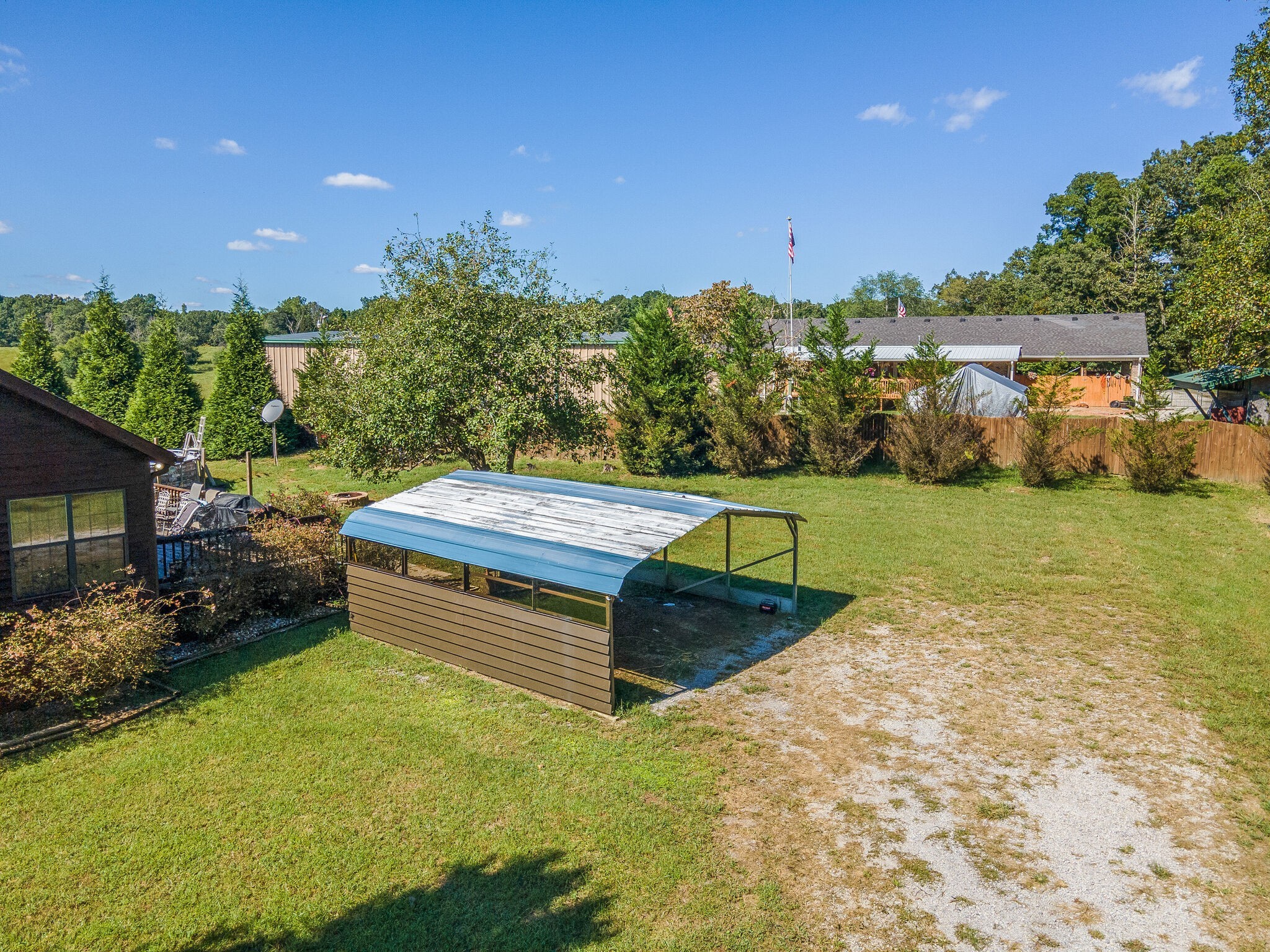 580 Eno Road Dickson, TN 37055 - Photo 44 of 48 a view of a swimming pool with lawn chairs and a yard