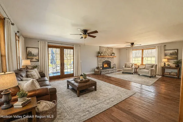 a living room with furniture and a large window