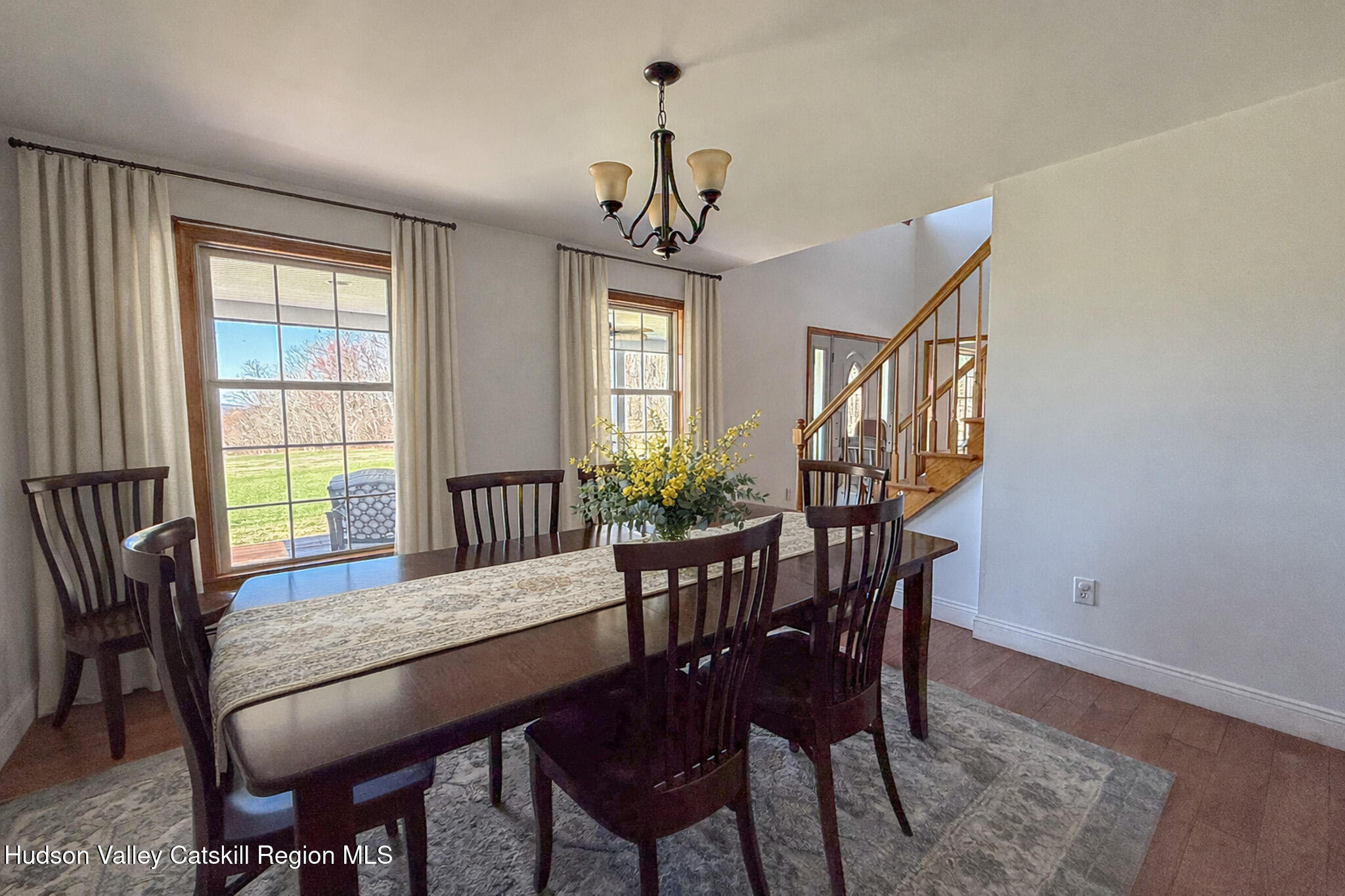 521 Hall Hill Road Ancram, NY 12502 - Photo 16 of 34 a view of a dining room with furniture window and wooden floor