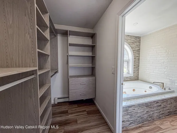 a bathroom with a bathtub and a shower