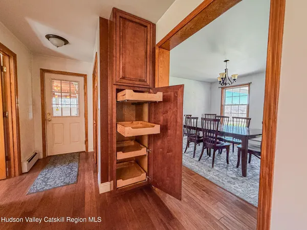 a view of a livingroom with furniture and hardwood floor