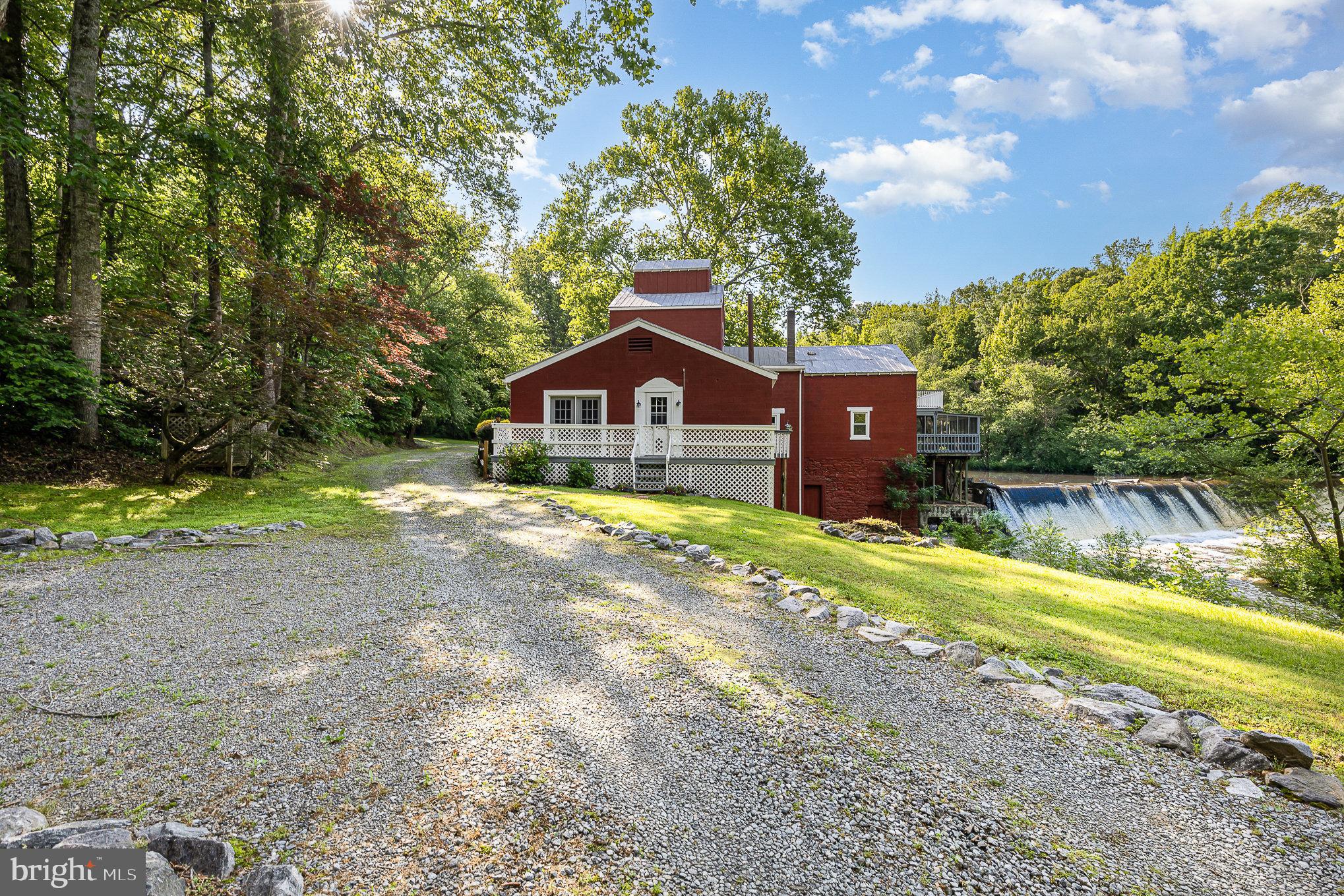 6908 South Roxbury Mill Road Spotsylvania, VA 22551 - Photo 2 of 92 a house view with a big yard plants and large trees