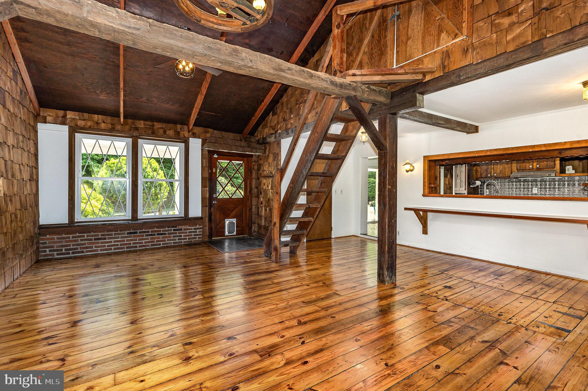 6908 South Roxbury Mill Road Spotsylvania, VA 22551 - Photo 26 of 92 a view of an empty room with wooden floor and a window
