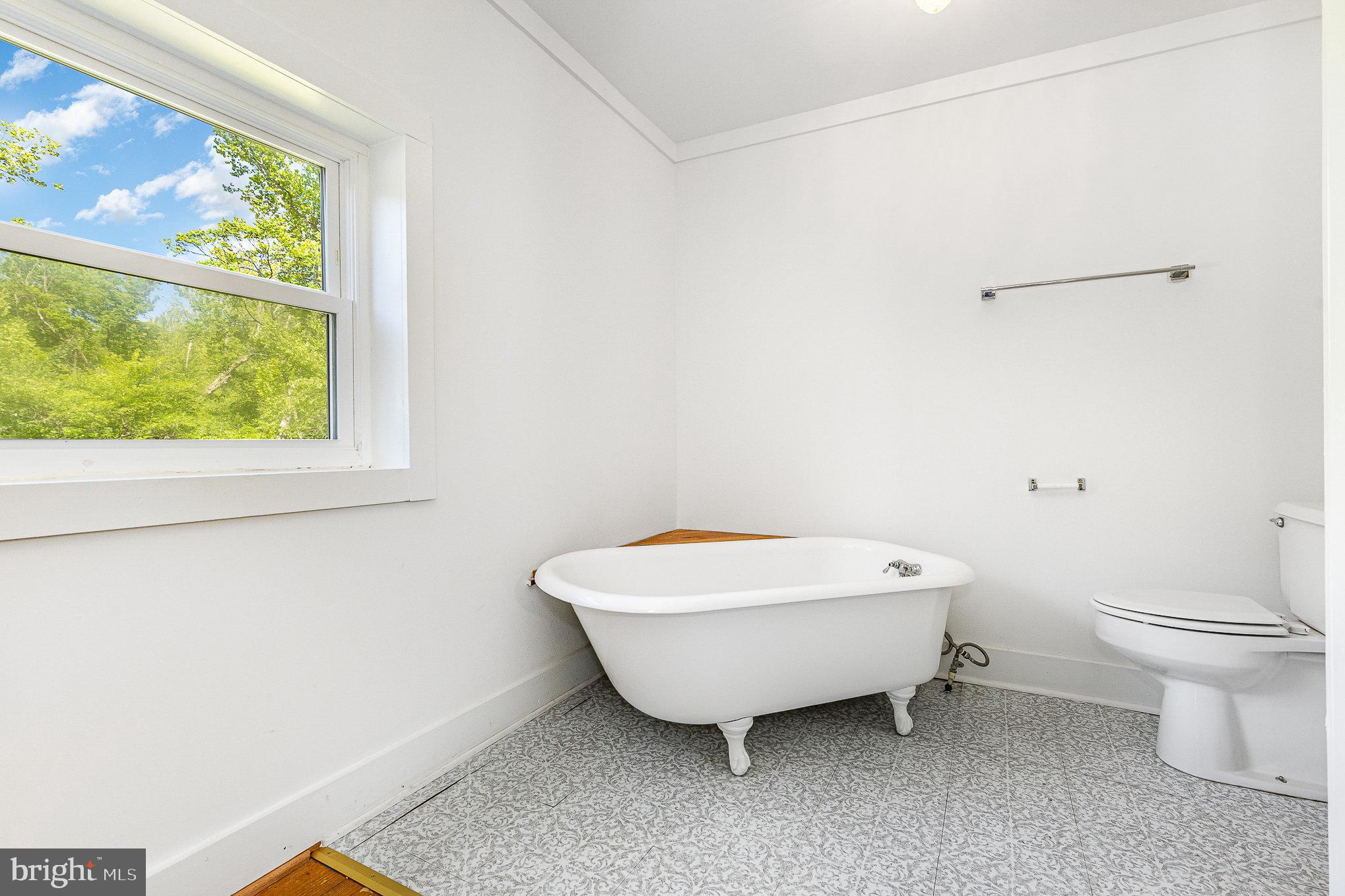 6908 South Roxbury Mill Road Spotsylvania, VA 22551 - Photo 32 of 92 a bathroom with a toilet a sink and a window