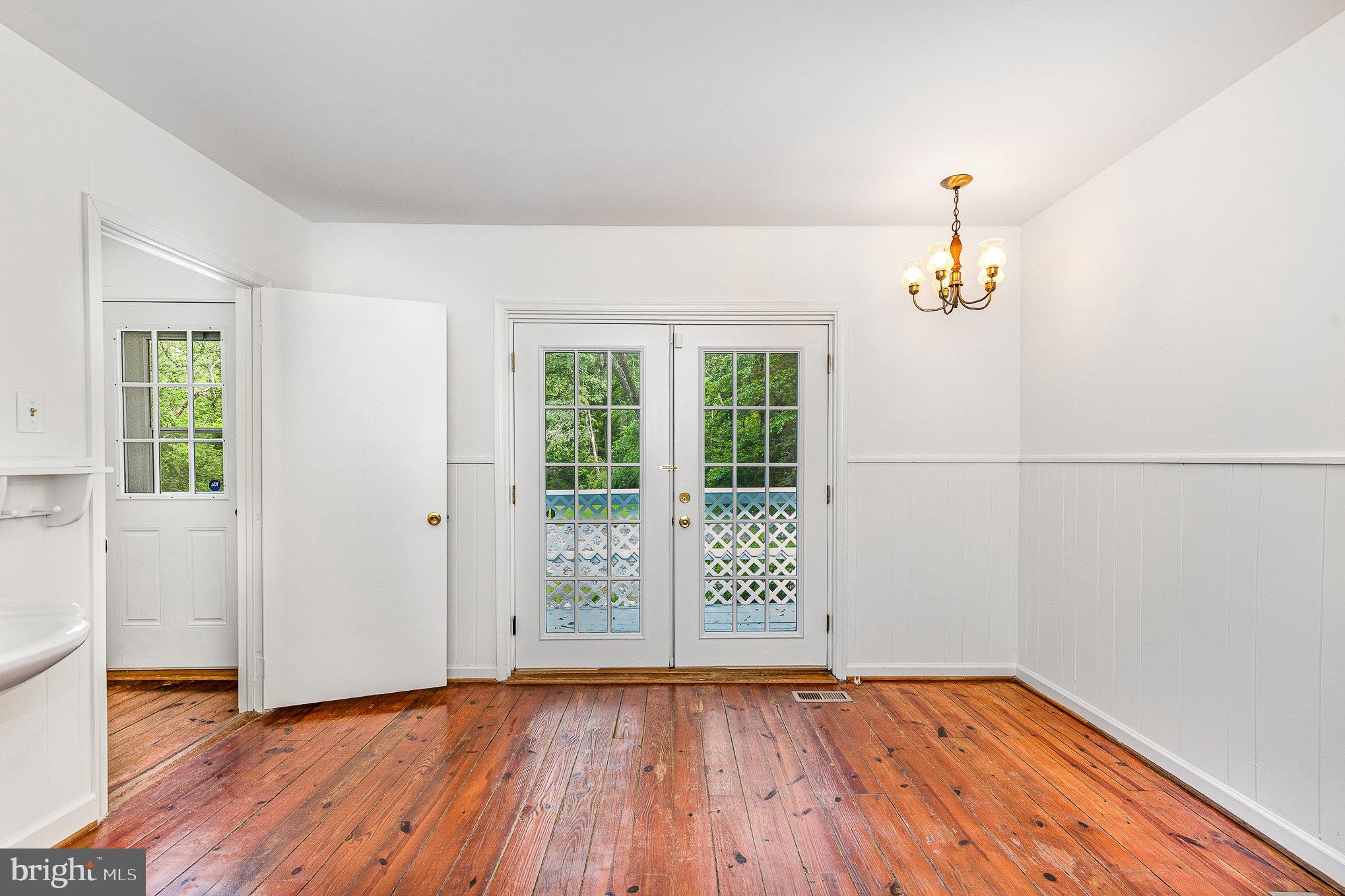 6908 South Roxbury Mill Road Spotsylvania, VA 22551 - Photo 37 of 92 an empty room with wooden floor and window