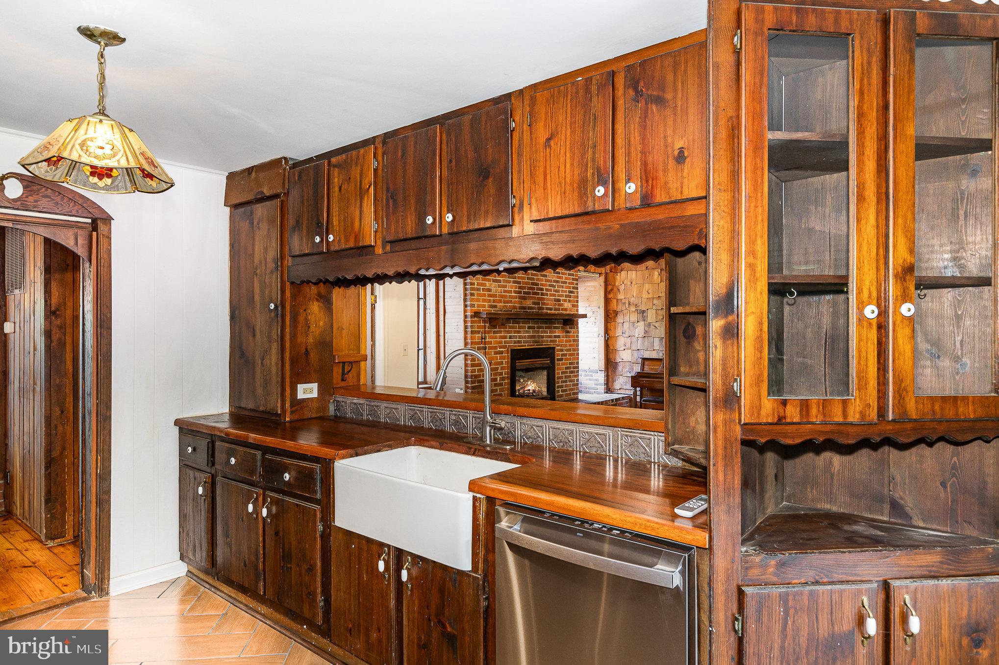 6908 South Roxbury Mill Road Spotsylvania, VA 22551 - Photo 40 of 92 a kitchen with granite countertop a stove and a sink
