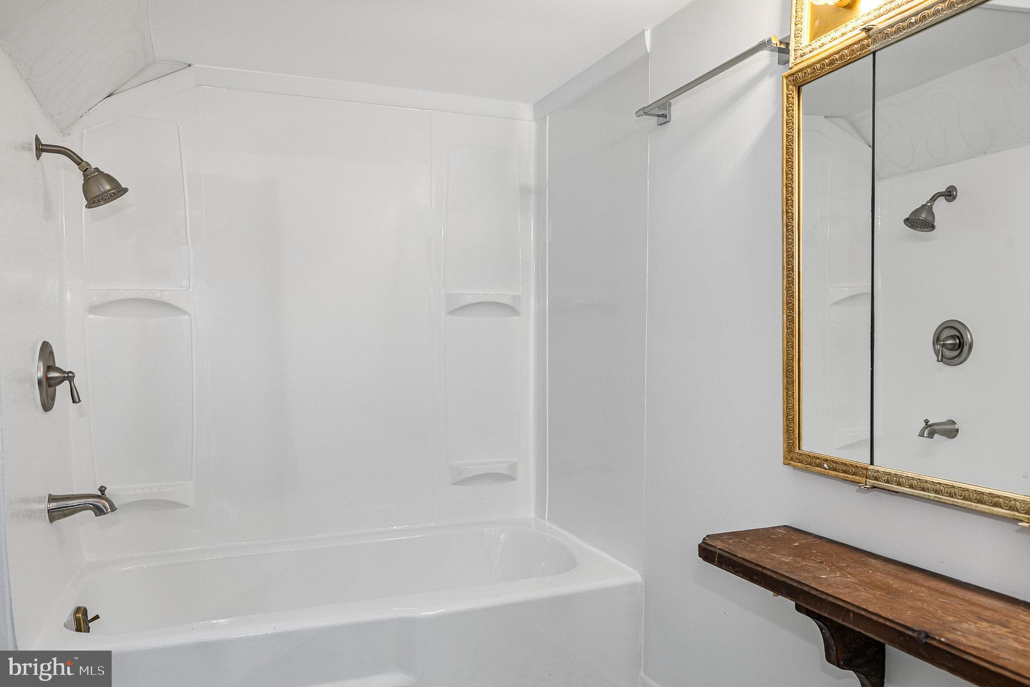 6908 South Roxbury Mill Road Spotsylvania, VA 22551 - Photo 53 of 92 a bathroom with a shower and a bath tub