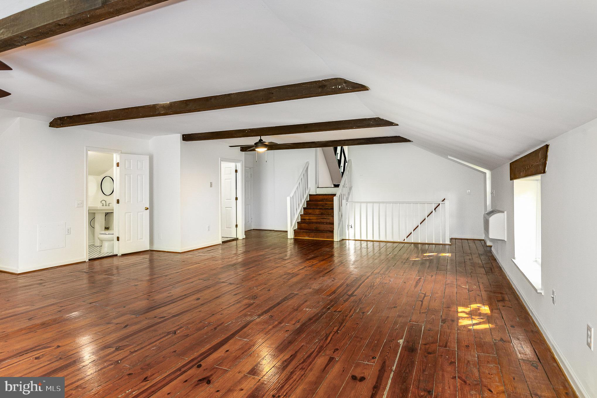 6908 South Roxbury Mill Road Spotsylvania, VA 22551 - Photo 54 of 92 a view of empty room with wooden floor and white walls
