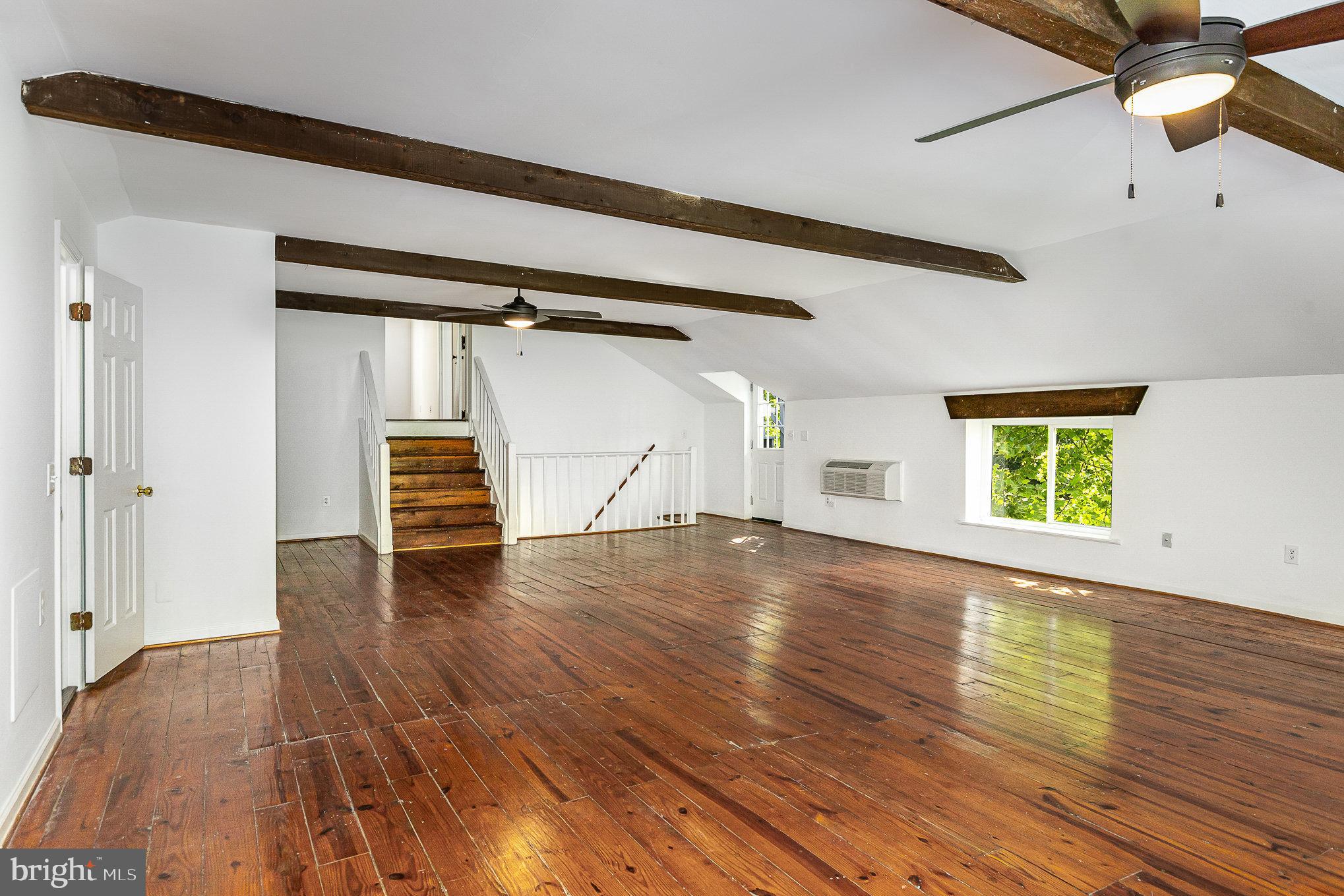 6908 South Roxbury Mill Road Spotsylvania, VA 22551 - Photo 55 of 92 a view of empty room with wooden floor and fan