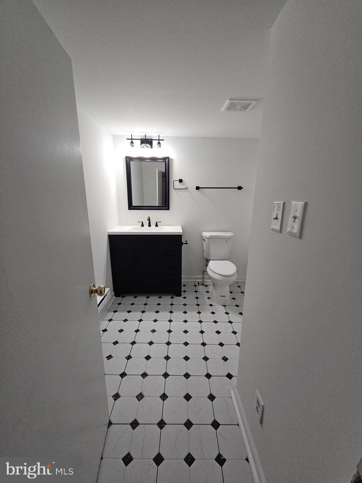 6908 South Roxbury Mill Road Spotsylvania, VA 22551 - Photo 73 of 92 a bathroom with a sink a toilet and mirror