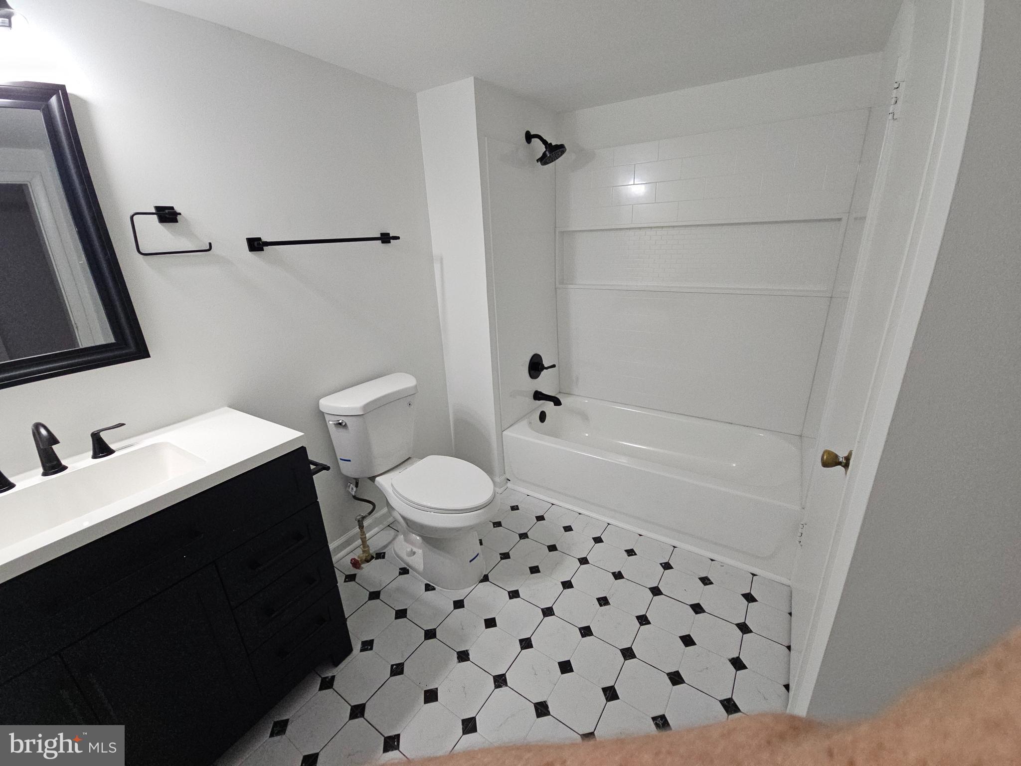 6908 South Roxbury Mill Road Spotsylvania, VA 22551 - Photo 85 of 92 a bathroom with a sink toilet and shower