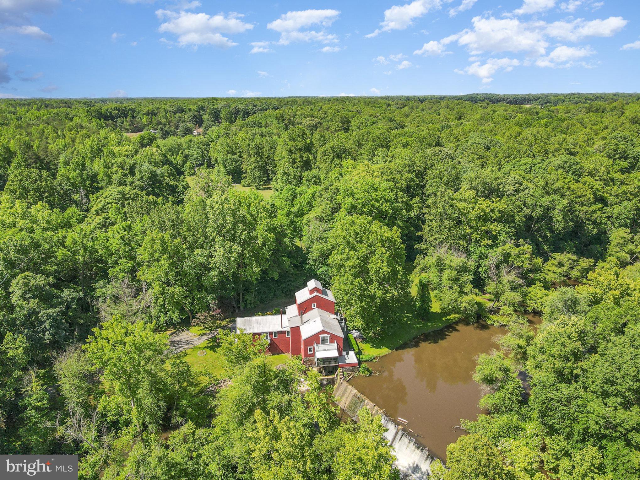 6908 South Roxbury Mill Road Spotsylvania, VA 22551 - Photo 88 of 92 an aerial view of a house with a yard and lake view