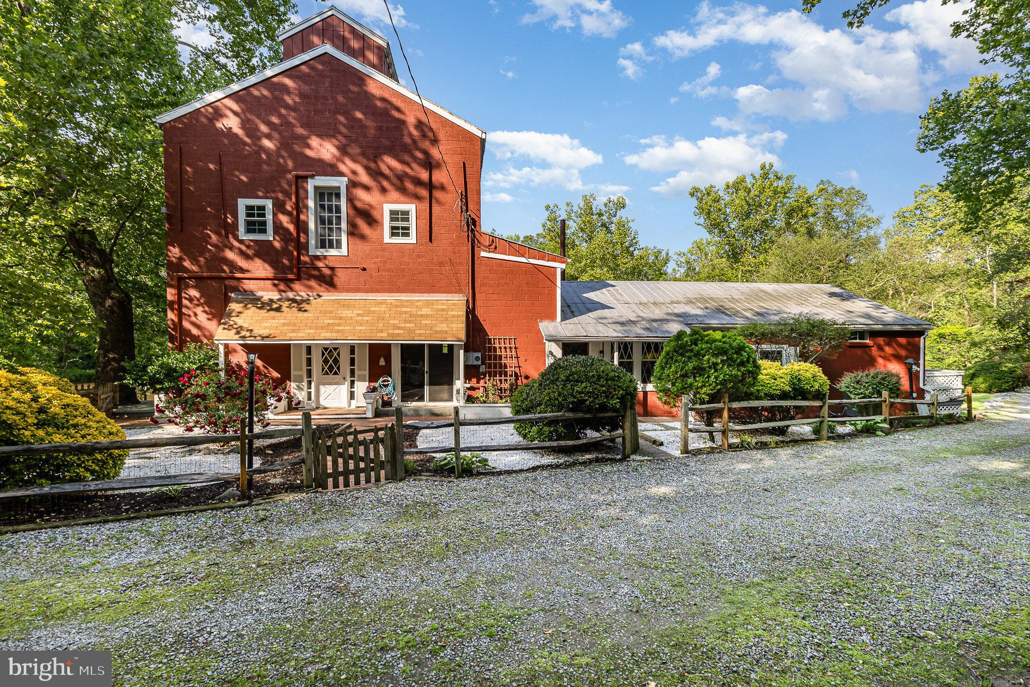6908 South Roxbury Mill Road Spotsylvania, VA 22551 - Photo 9 of 92 a view of a blue house with a yard and sitting area
