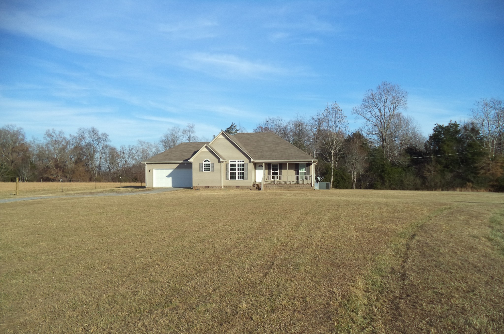 69 Robertson Hollow Road Taft, TN 38488 - Photo 1 of 21 a view of house with yard and mountain in the background