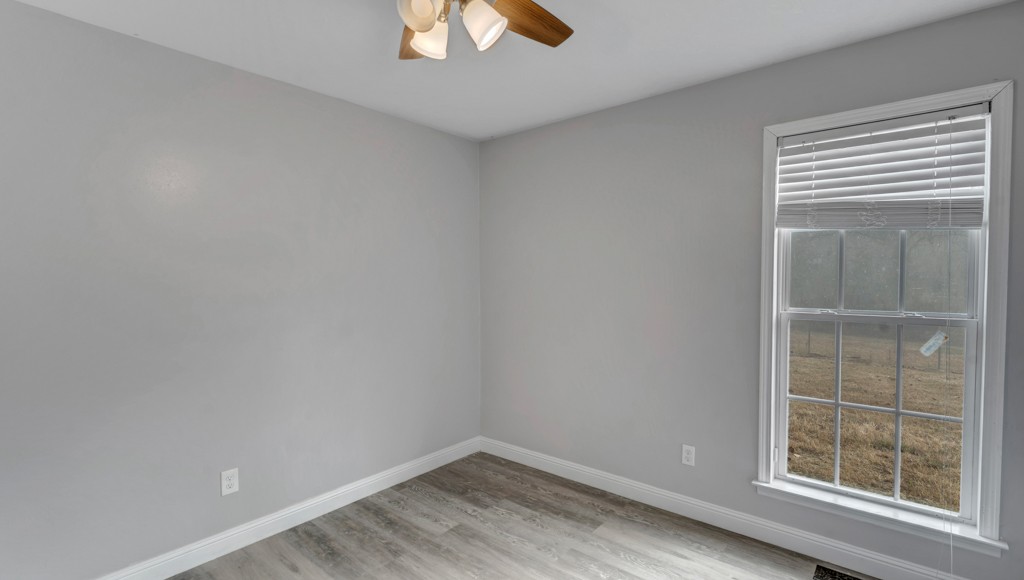 69 Robertson Hollow Road Taft, TN 38488 - Photo 18 of 21 an empty room with a window