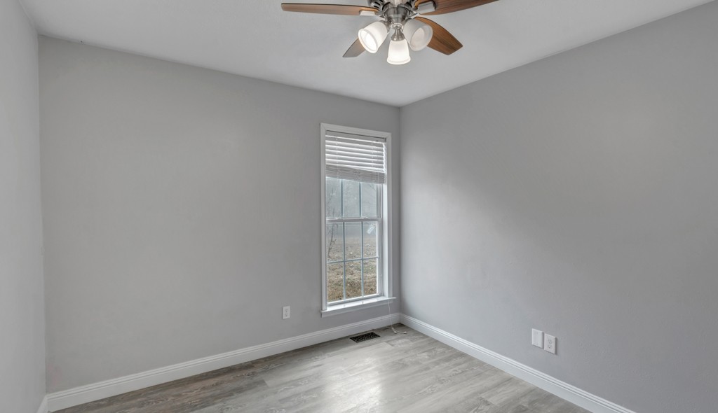69 Robertson Hollow Road Taft, TN 38488 - Photo 19 of 21 wooden floor in an empty room with a window