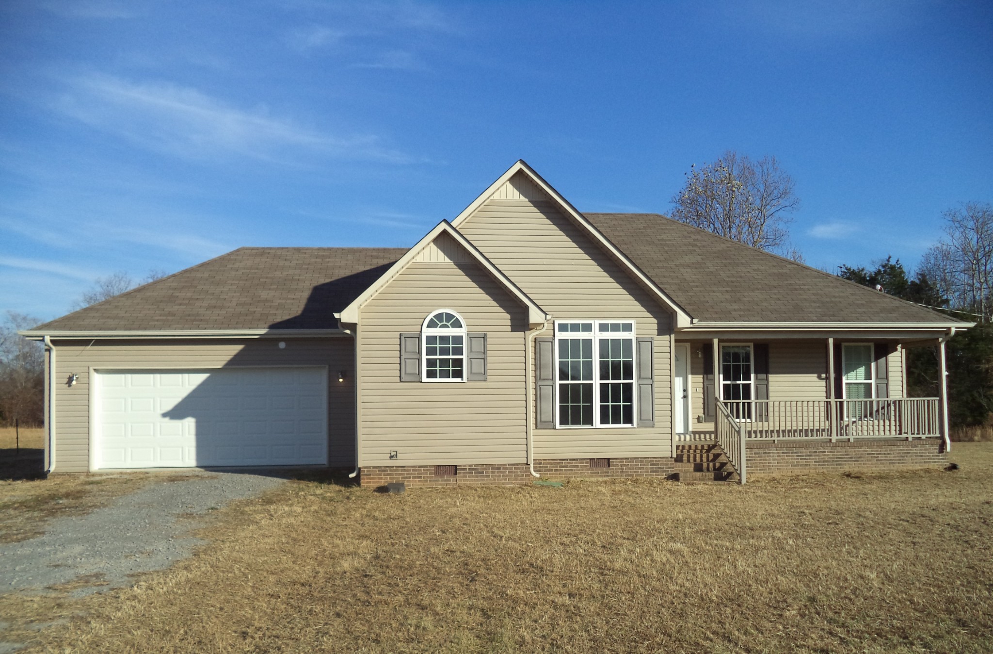 69 Robertson Hollow Road Taft, TN 38488 - Photo 2 of 21 a front view of a house with garage
