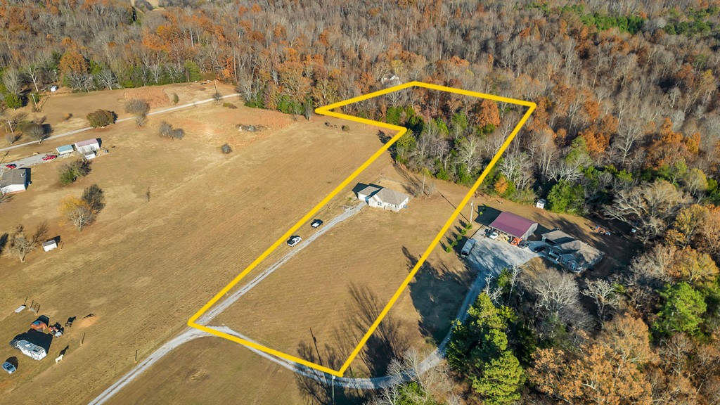 69 Robertson Hollow Road Taft, TN 38488 - Photo 4 of 21 an aerial view of a house with a swimming pool