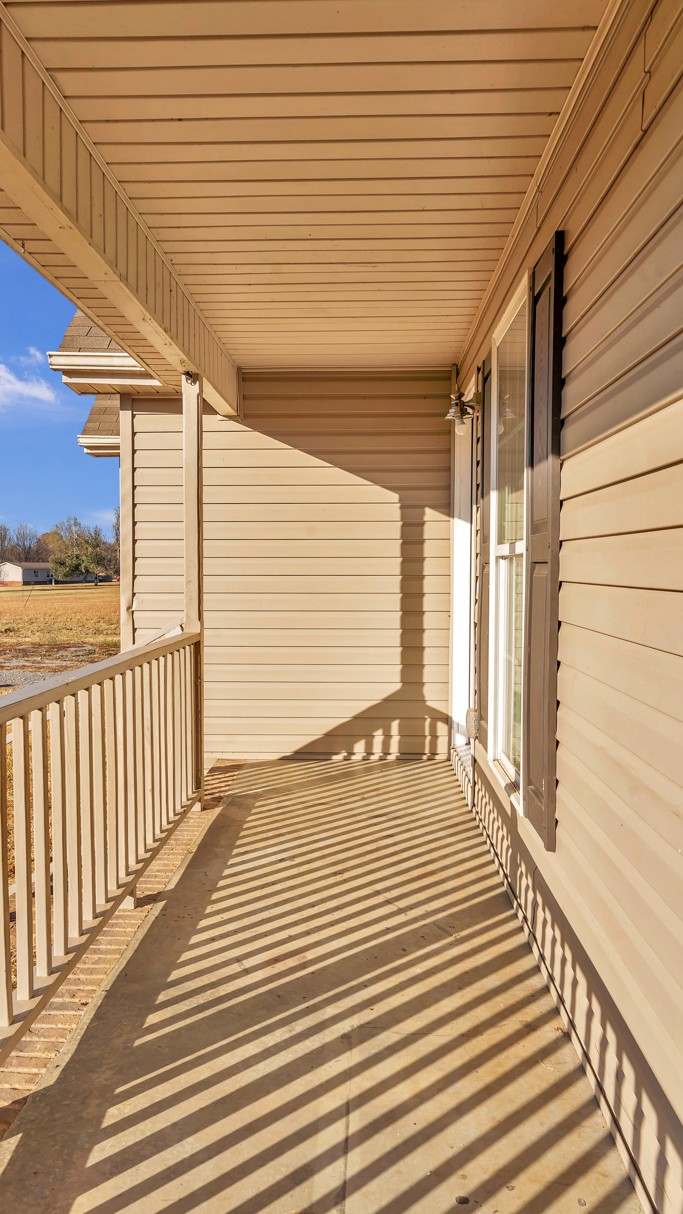 69 Robertson Hollow Road Taft, TN 38488 - Photo 8 of 21 a view of a balcony with wooden floor