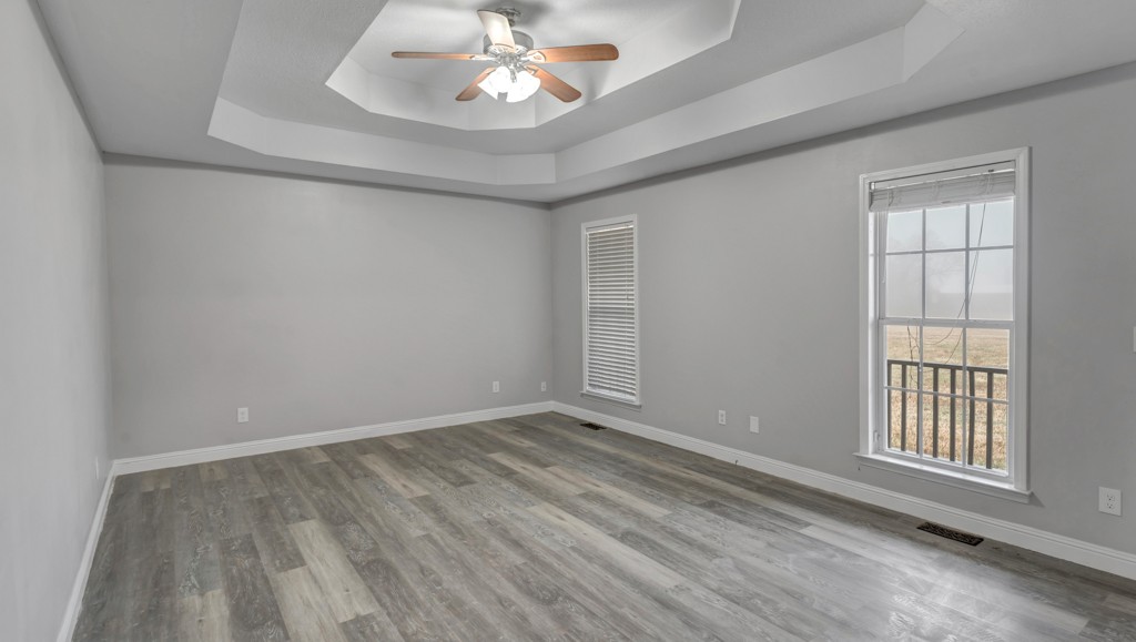 69 Robertson Hollow Road Taft, TN 38488 - Photo 9 of 21 wooden floor in an empty room with a window