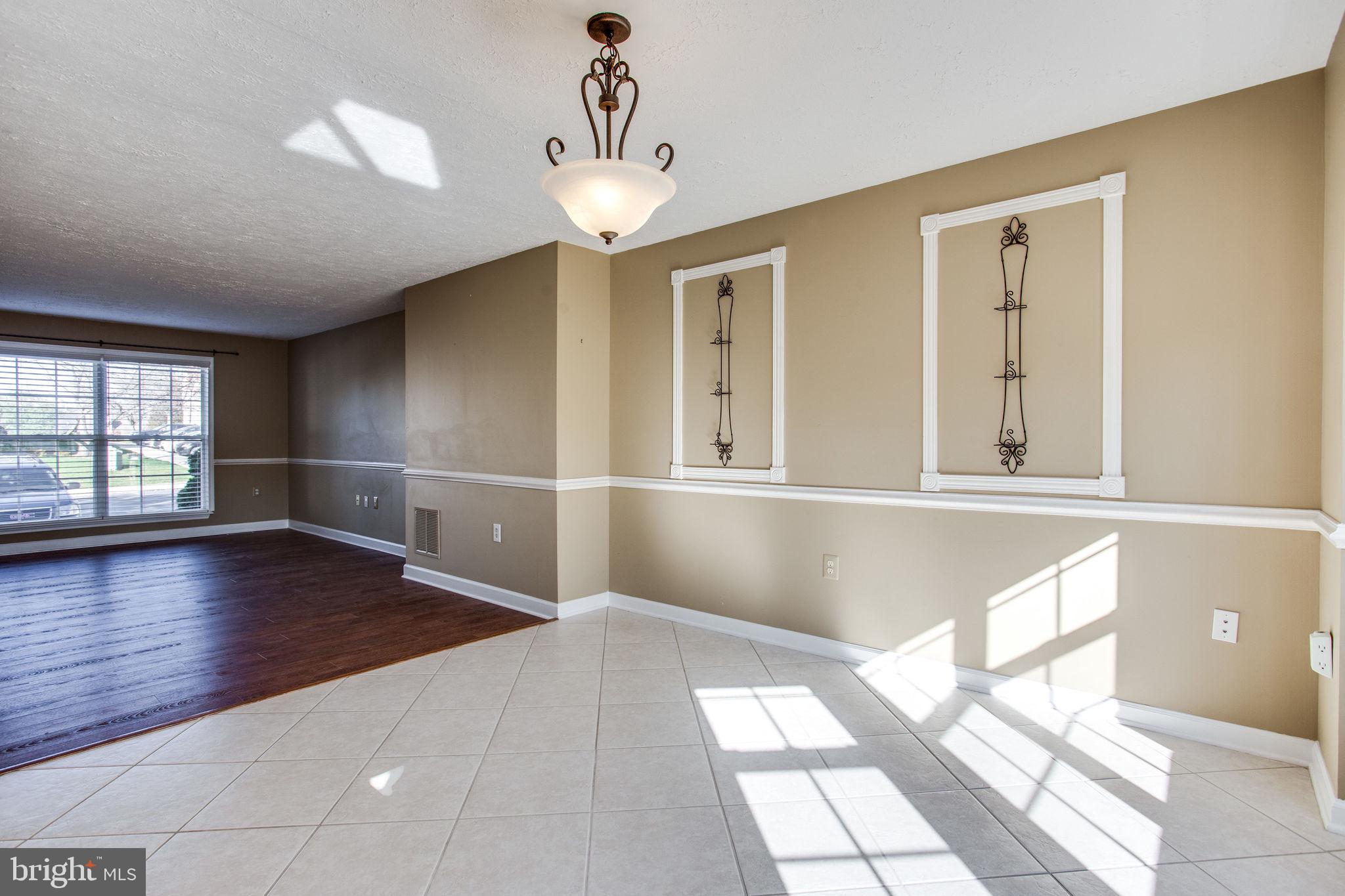 6121 Baldridge Circle Frederick, MD 21701 - Photo 17 of 60 a view of empty room with wooden floor and fan
