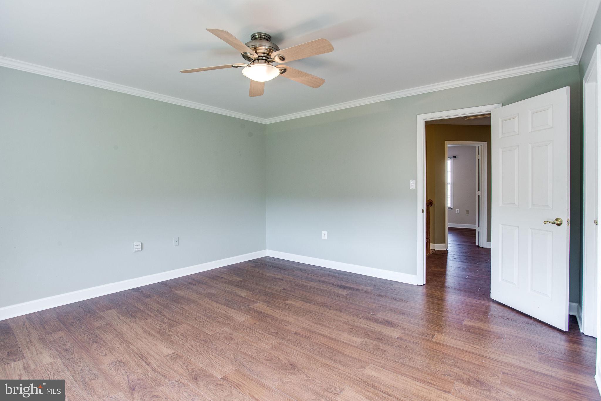6121 Baldridge Circle Frederick, MD 21701 - Photo 31 of 60 a view of an empty room with wooden floor